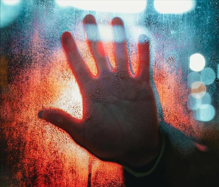 Hand Touching Glass
